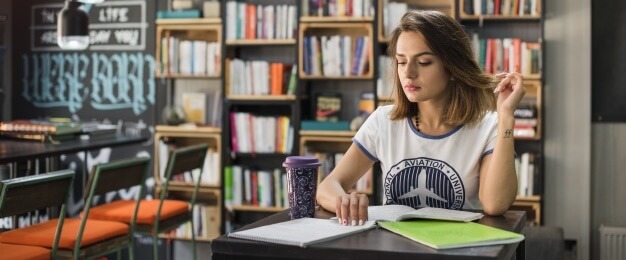 Gril studying in the cafeteria