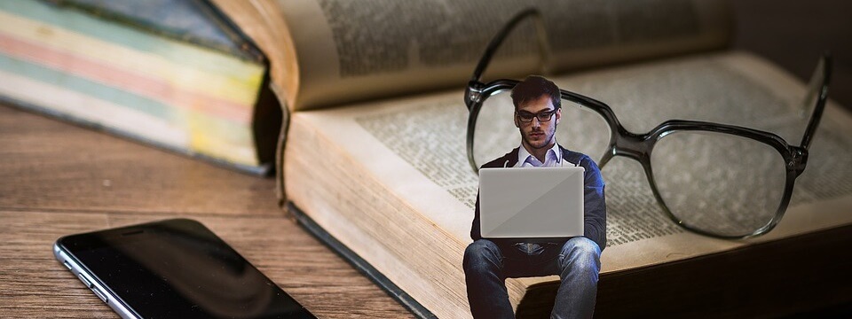 Boy reading and educating in library